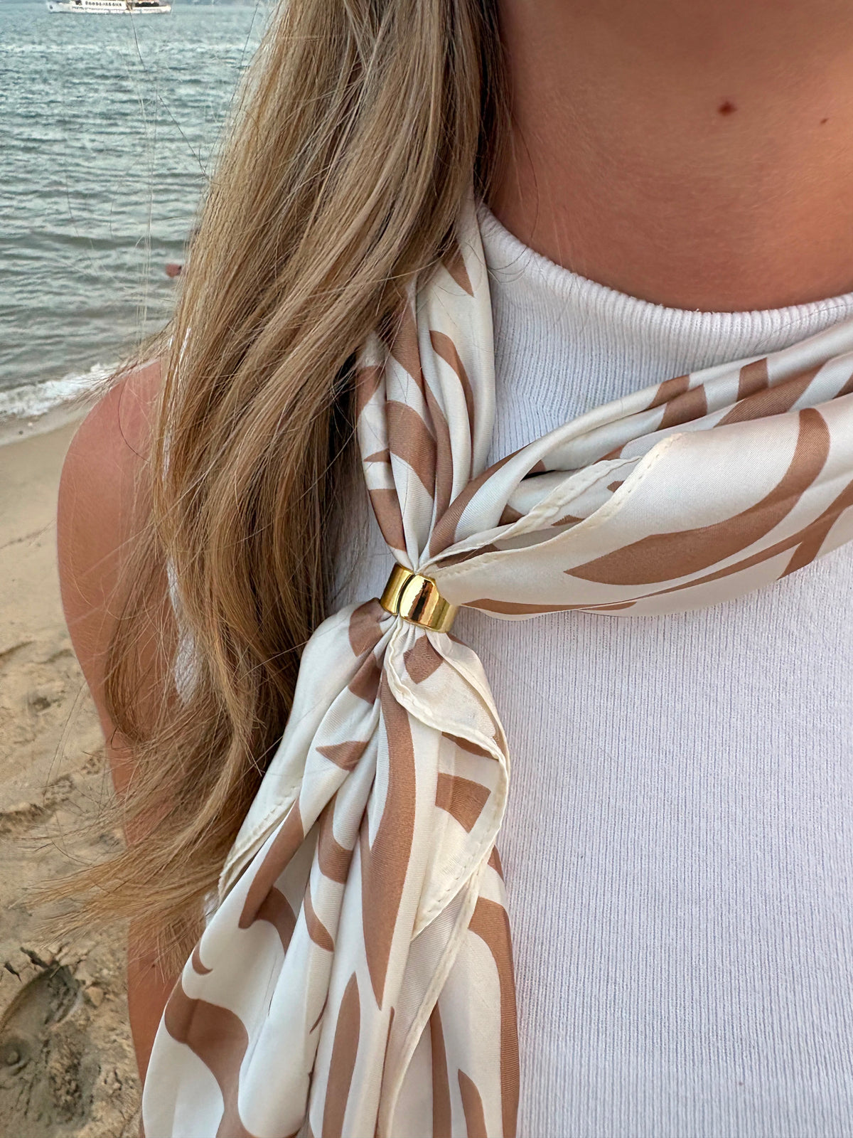 Feuille Scarf worn as neckerchief at the beach