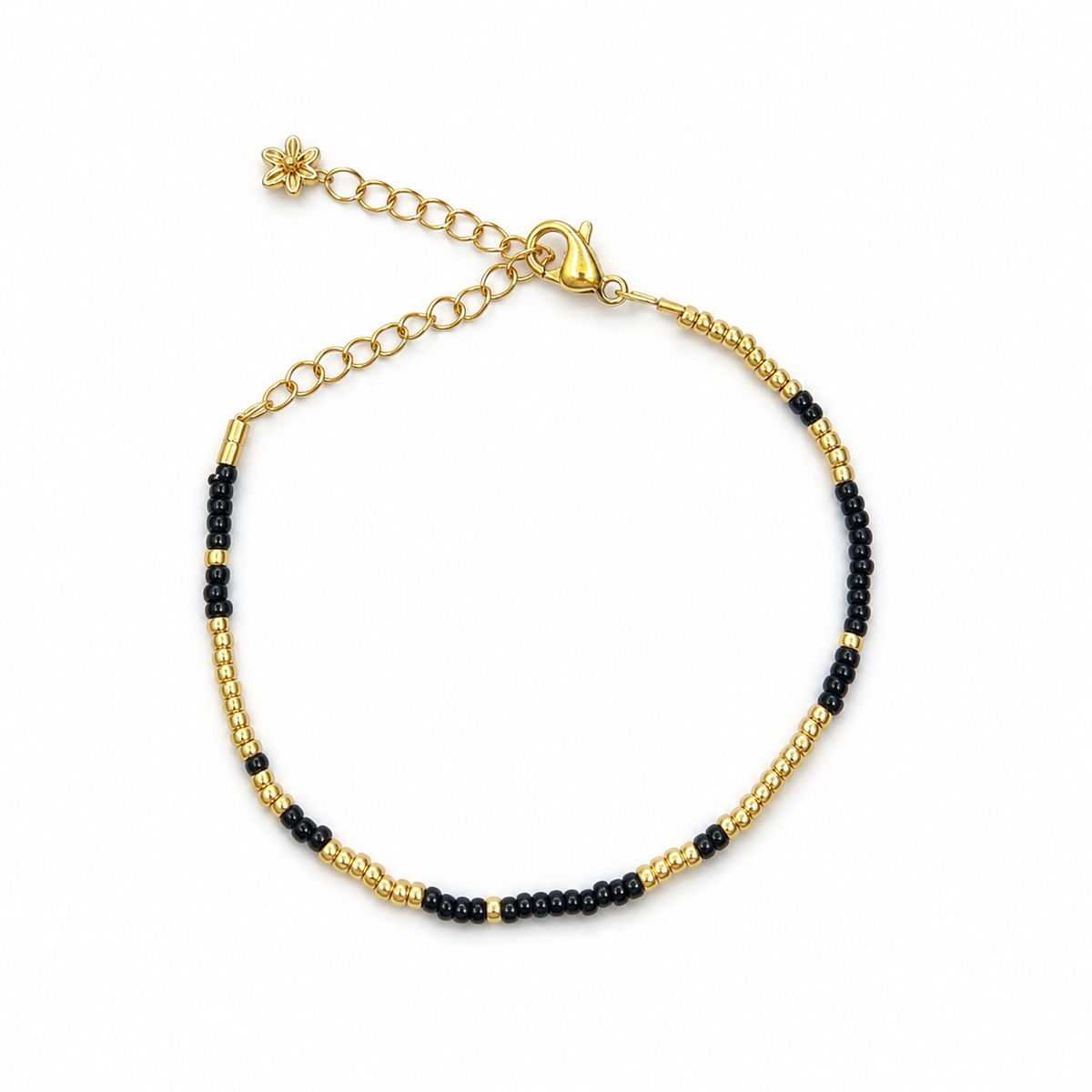 Midnight Gold Bracelet – black and gold beaded bracelet with gold flower charm