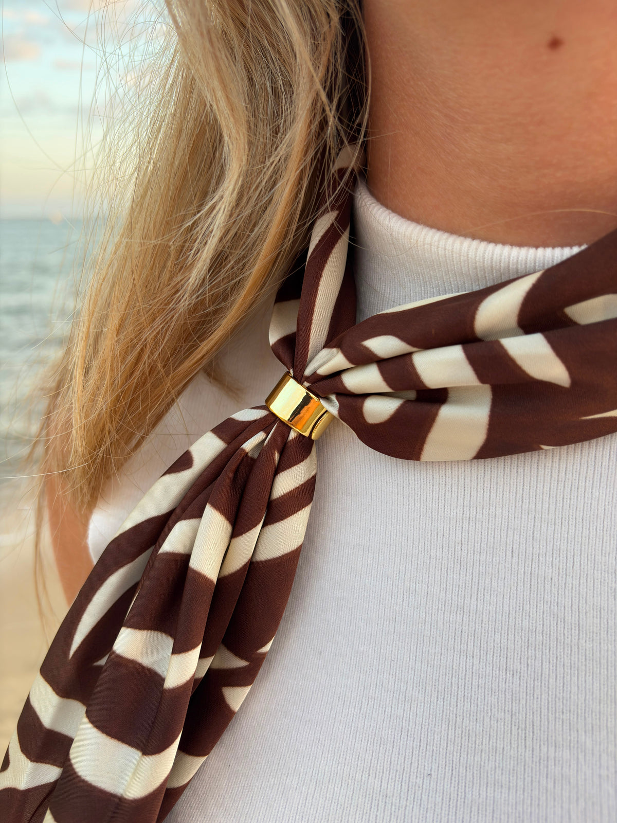 Marron Scarf worn as neckerchief at the beach